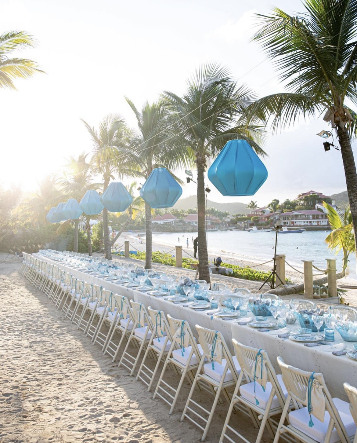 Beach dinner table under palm lanterns, St Barths